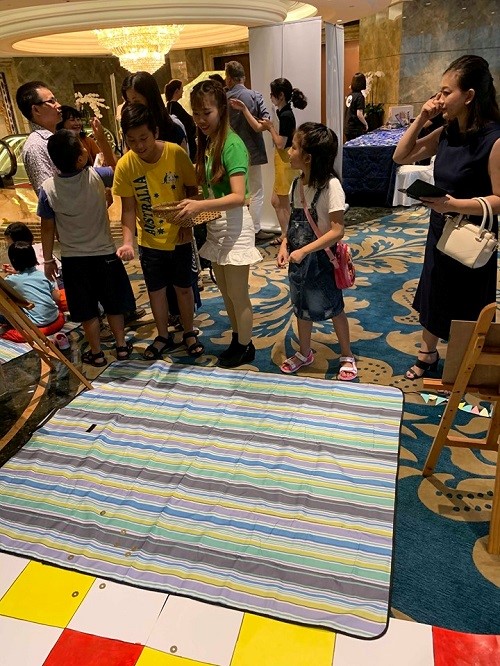 Children excitingly participate in the play zone 