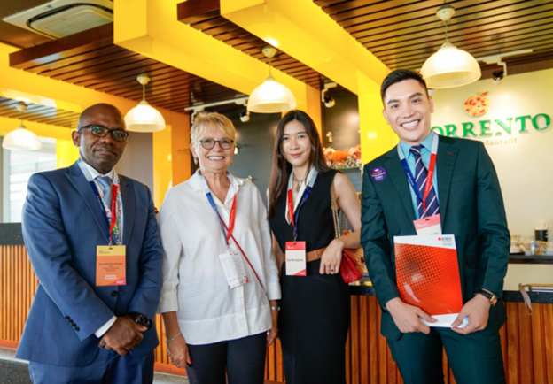 Minh Beta and two dean professors (left) who work at RMIT University Vietnam.