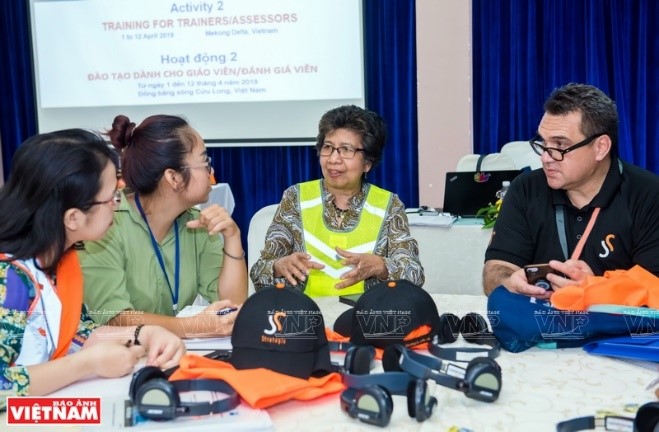 Ms. Lou De Castro Myles and fellow instructor listen to and support their mentees